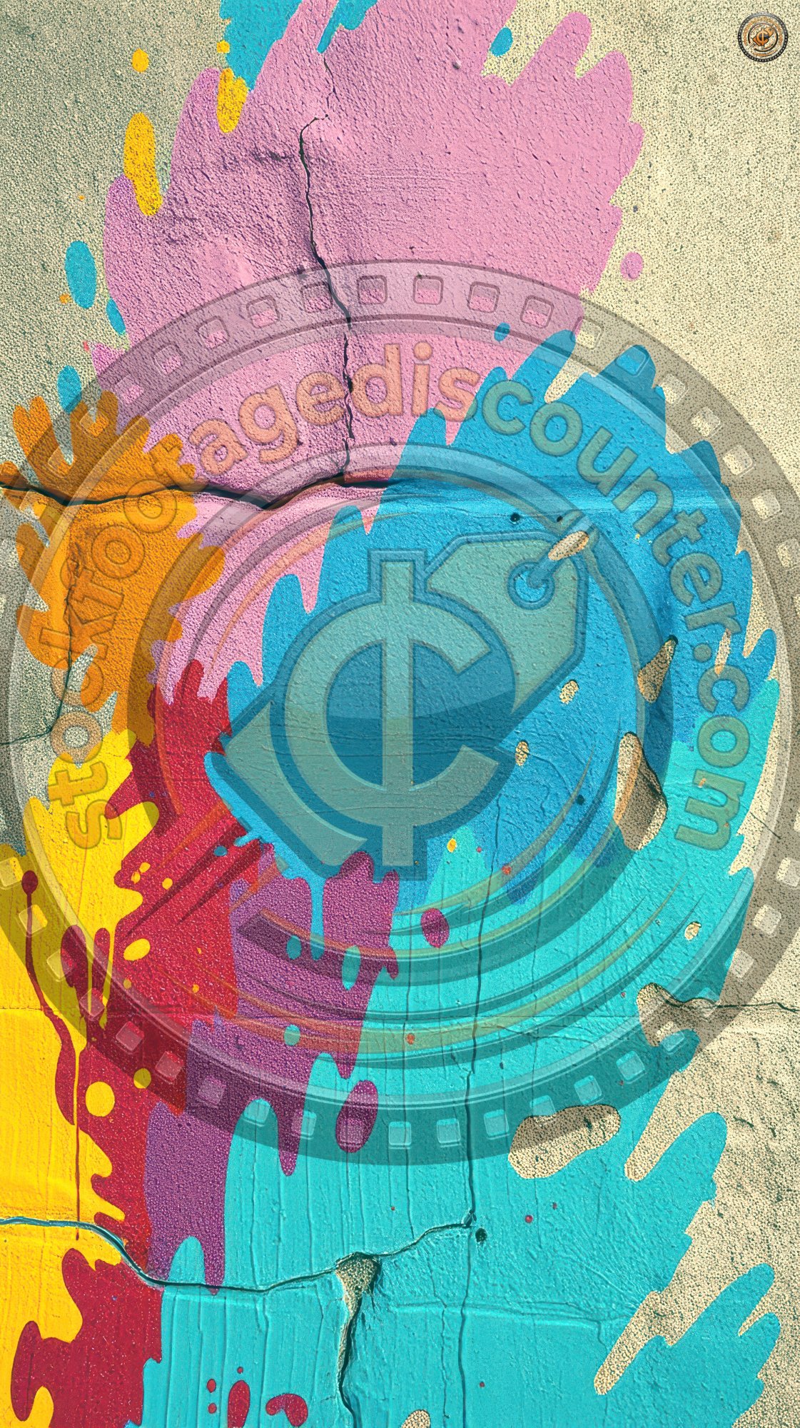 C o l o r f u l   p a i n t   s p l a s h e s   d e c o r a t e   a   c o n c r e t e   w a l l   i n   a n   u r b a n   a r e a   d u r i n g   d a y t i m e   h o u r s