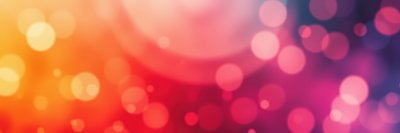 Colorful bokeh background with vibrant hues creating a lively ambiance suitable for celebrations