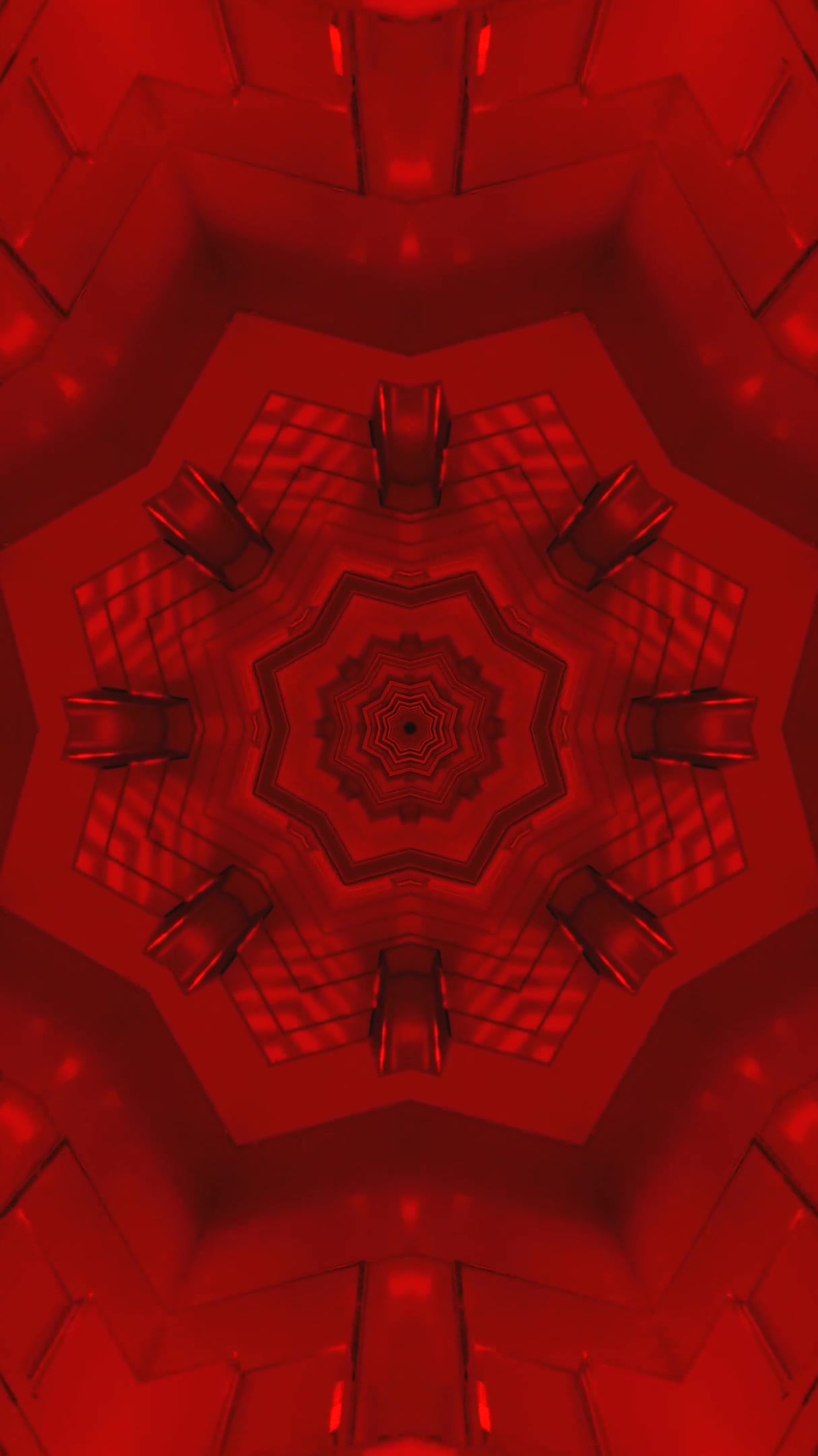 Seamless tunnel video loop screensaver with red kaleidoscopic patterns and intricate designs moving continuously