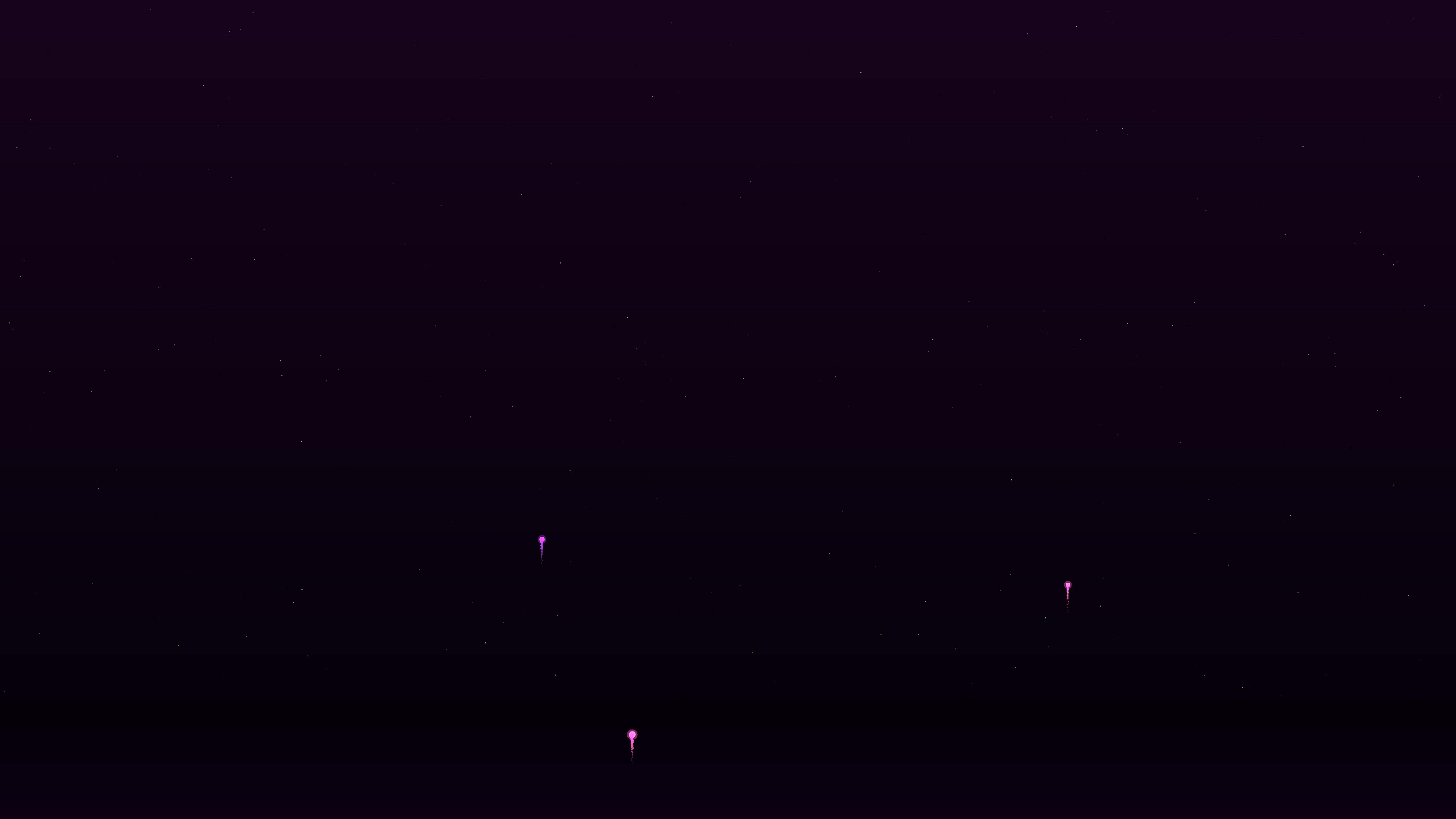 Neon glow firework display with glitter effect bursts at nighttime event